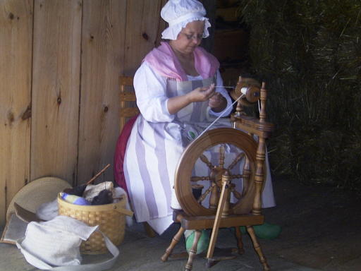 Spinning , notice her wooden shoes 